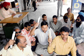 Members of the National Federation of Blind protest in support of their demands in Sector 34, Chandigarh, on Monday