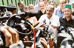 Himachal Pradesh Chief Minister Virbhadra Singh with senior Congress leader R.K. Dhawan talks to media persons in New Delhi on Monday.