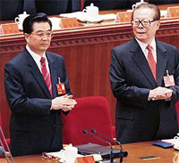 China's former president Jiang Zemin (right) looks at President Hu Jintao during the opening of the 17th National Congress of the Communist Party of China in Beijing on Monday.
