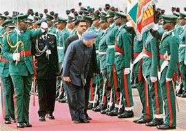 Prime Minister Manmohan Singh during ceremonial welcome in Abuja, Nigeria, on Monday.