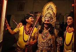 Rama, Lakshmana and Ravana share jokes as they prepare to go for a final battle during the rehearsal of Ramlila ahead of Dussehra in Jammu on Monday.