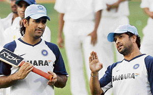 Mahendra Singh Dhoni (L) listens to Sachin Tendulkar during a training session at the Wankhede stadium on Tuesday on the eve of the final one-day international between India and Australia in Mumbai. Australia have an unassailable lead of 4-1 in the seven-match series