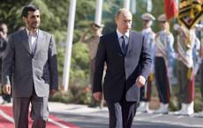 Iranian President Mahmoud Ahmadinejad and his Russian counterpart Vladimir Putin review the honour guard during an official welcoming ceremony for Putin in Teheran on Tuesday.