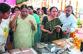 Padmini Narayanan, wife of M.K. Narayanan, National Security Advisor (2nd Left) visits a stall after the inauguration of ITBP Welfare Exhibition in the Capital