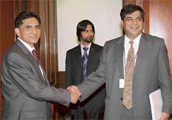 Indian joint secretary for Pakistan, Afghanistan and Iran T.C.A Raghavan (right) shakes hands with Pakistan delegation director-general Aizaz Ahmed Choudhary prior to delegation-level talks on conventional confidence-building measures in New Delhi on Thursday.