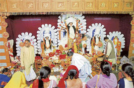 Devotees offer prayers during mahaashtami pujan at the Kali Bari temple in Shimla on Friday. 