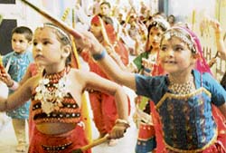 Children of Love Dale School perform dandia during a Navratra function in Ludhiana