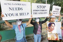 Exiled Myanmar protesters raise slogans as they hold pictures of Nobel Prize winner Aung San Suu Kyi during a demonstration against the junta crackdown on peaceful protesters, outside Congress chairperson Sonia Gandhis residence in New Delhi on Friday. They urged the Indian government to intervene to stop