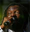 South African reggae singer Lucky Dube performs at the global call concert against poverty in Johannesburg. A well-known music artiste, Lucky Dube was killed in an attempted hijack in Johannesburg on Thursday, the police said.