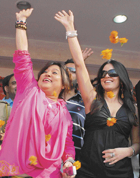 Mahima Chaudhary (right) waves to the crowd at the inauguration of a franchise of a jewellers brand in Karnal on Saturday