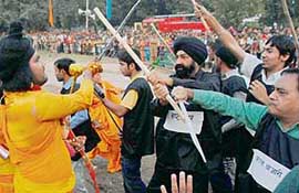 Jaspal Bhatti and his men posing as social evils fight with Lord Rama’s sena during the Dussehra celebrations in Sector 24, Chandigarh, on Sunday.