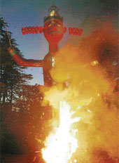 An effigy of Ravana goes up in flames at Jakhu Temple in Shimla on Sunday.