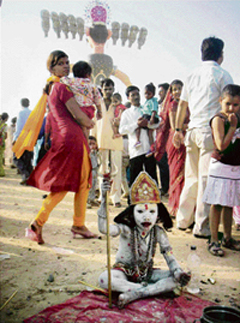 A child seeks attention at the Dussehra ground in Faridabad on Sunday