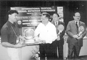 Dr Chander Datt being honoured for his contribution to animal nutrition at the