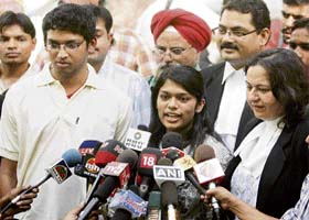 Telugu superstar Chiranjeevi's daughter Srija and son-in-law Sirish Bhardwaj speak to mediapersons after seeking police protection at the Delhi High Court