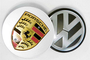 This file photo shows logos of German carmakers Porsche (left) and Volkswagen at a car centre in Wilhelmshaven, northern Germany.