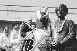 President of the BJP Rajnath Singh garlands the statue of Pandit Prem Nath Dogra in Jammu on Tuesday.