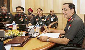 Chief of Army Staff Gen Deepak Kapoor smiles as he talks with commanders during the Army Commanders' Conference in New Delhi on Tuesday.