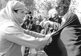 Jammu and Kashmir Khawateen Markaaz activists being arrested during a protest against human rights violations in the Kashmir valley on the United Nations Day in Srinagar