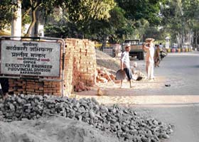 Construction material dumped on the roadside in Naraingarh right in front of the office of the executive engineer, creating a traffic hazard