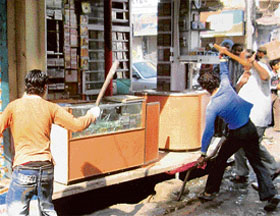 Youths on rampage following the shooting of a youth by a relative of an Akali MLA at Hall Bazaar in Amritsar on Friday.