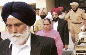 NRI groom Gurpreet Singh and his parents come out from the Patiala court