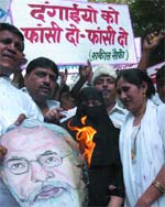 Activists of Akhil Bhartiya Muslim Yuva Ekta committee shout slogans against Gujarat Chief Minister Narendra Modi during ademonstration in the Capital on Sunday. 