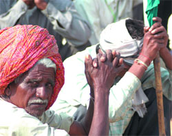 Protesters sit at Ramlila Ground in the Capital on Monday. More than 25,000 protesters arrived in New Delhi after marching nearly 600 km from Gwalior to Delhi to demand land reforms.