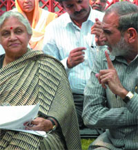 Outer Delhi MP Sajjan Kumar demands compensation for the acquired land of farmers from Chief Minister Sheila Dikshit in the Capital on Monday.