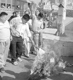 Members of BJP Yuva Morcha burn the effigy of UPA president Sonia Gandhi in Ambala on Monday.