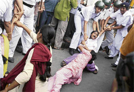 Activists of the Socialist Unity Centre of India (SUCI) stage a demonstration in Kolkata on Tuesday.