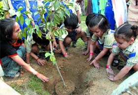 Schoolchildren plant trees at Appu Ghar on her 23rd death anniversary in the Capital on Wednesday. 