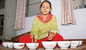 A girl plays jal tarang during the ongoing zonal youth festival at Ramgarhia Girls College in Ludhiana on Wednesday.