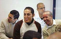 Defendants accused of participation in Spains worst terror attack on March 11, 2004, sit inside the security room