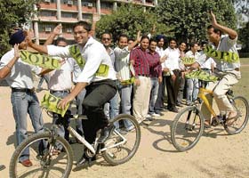 SOPU supporters campaign in the university while two of them pedal around to garner votes for the upcoming elections