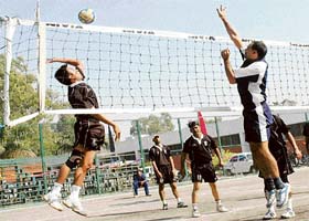 Spikers in action during the North Zone Volleyball Tournament at Sports Complex, Sector 7, in Chandigarh