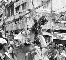 Activists burn an effigy of Narendra Modi in Allahabad.