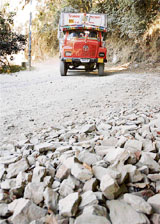 A truck driver tries to manoeuvre the badly maintained state highway which connects the famous Naldehra Golf Course 85 km from Shimla