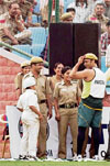 Pakistani cricketer Shoaib Akhtar wears the cap of a Delhi policeman during a practice match against Delhis Ranji Trophy team, at Ferozshah Kotla stadium in New Delhi on Friday.