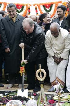 Heinz Buschkowsky (centre), mayor of Berlin's Neukoelin district, breaks the ground for a planned Sri Ganesha Temple