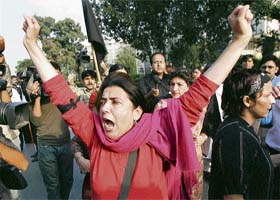 Pakistani civil rights activists raise anti-Musharraf slogans during a protest in Islamabad