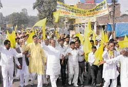 Supporters of suspended Congress MP Kuldeep Bishnoi, led by former minister Krishan Murti Hooda, hold a protest against the water and power crises in Kalanaur township in Rohtak district on Monday.