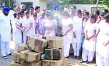 DRUGS ON FIRE: Punjab health minister Laxmi Kanta Chawla supervises the burning of seized drugs in Kapurthala on Monday.