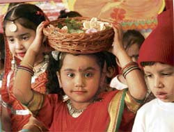 Tiny tots wear colourful dresses as they decorate their school ahead of Diwali in Ludhiana.