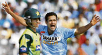 Indian seamer Irfan Pathan (R) celebrates after dismissing Pakistan's Kamran Akmal as Pakistan's Salman Butt watches during their first one-day match in Guwahati on Monday.