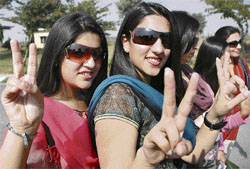 Pakistani cricket fans show victory sign at Attari near Amritsa
