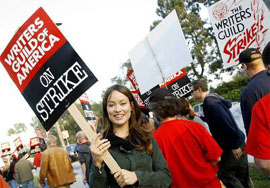 Actress Olivia Wilde walks a picket line, along with members of the Writers Guild of America, at one of the gates to Fox Studios in Los Angeles, California, on Monday.