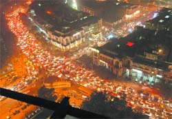 Traffic lights illuminate Connaught Place on Dhanteras. 