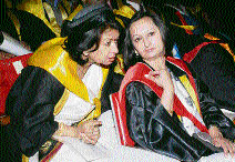 Two Himachal Pradesh University alumni after getting degrees at the 15th convocation in Shimla on Wednesday.