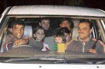 Noor Aga and his family being taken to Delhi by the Solan police. 
